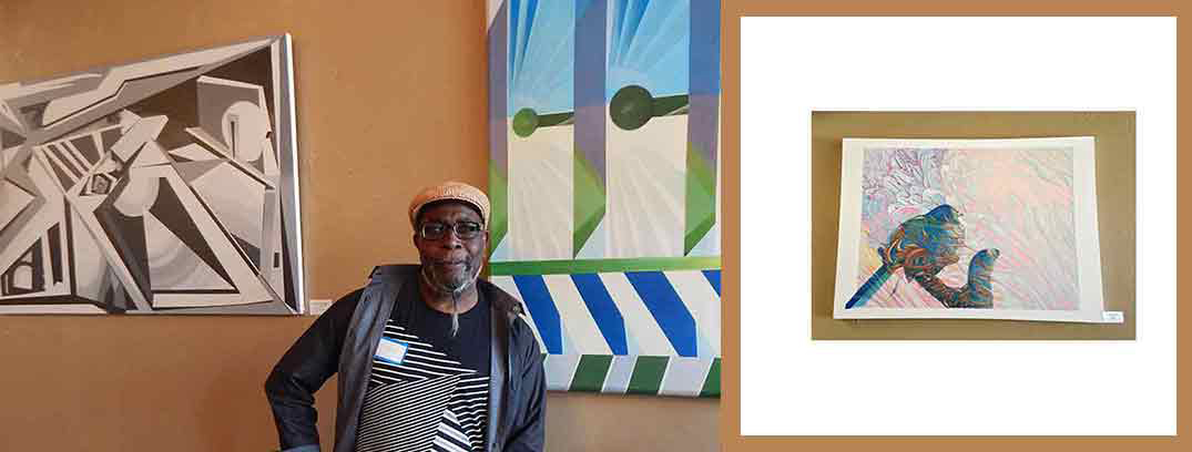 artist Hershell West standing in front of some of his art work